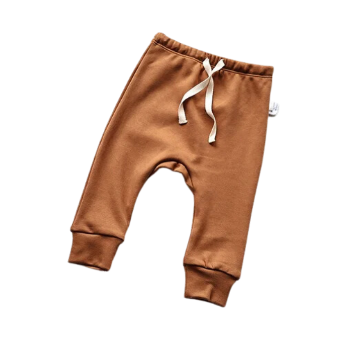 Brown baby pajama pants in a white background