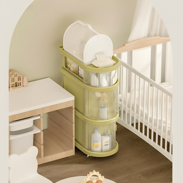 Green 4 Layer Baby Storage Rack Folding Trolley In A Nursery Room Beside Baby Bed