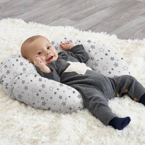 Baby Lying On A Baby Nursing Pillow