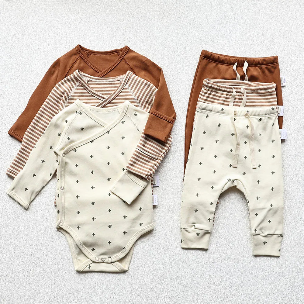 Baby Long sleeve bodysuit and pants set in three different designs and colors in a light gray background