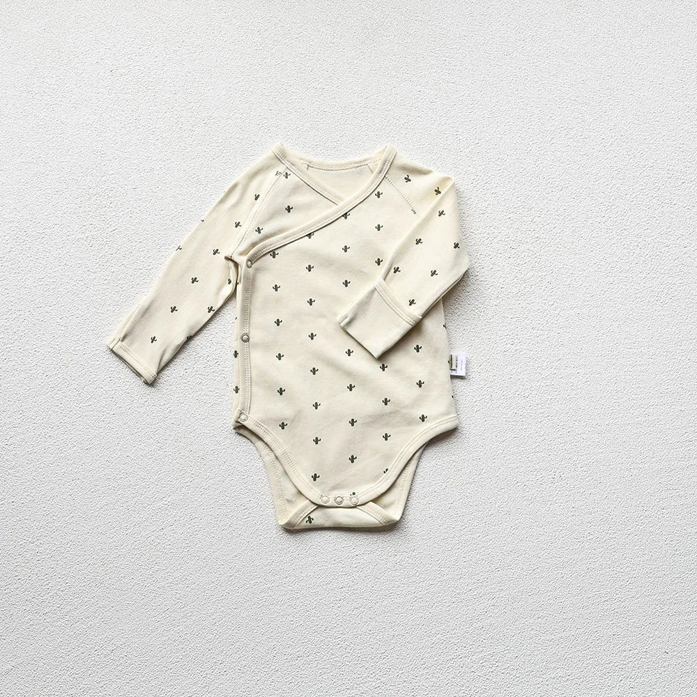 Moon Printed baby long sleeve bodysuit in a light gray background