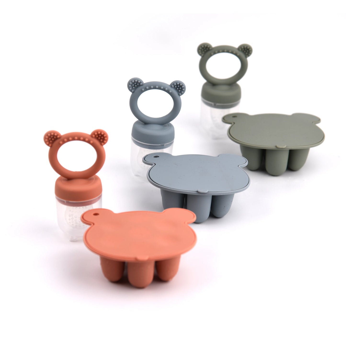 Colorful bear-shaped silicone molds and bottles with bear ear rings on white background.