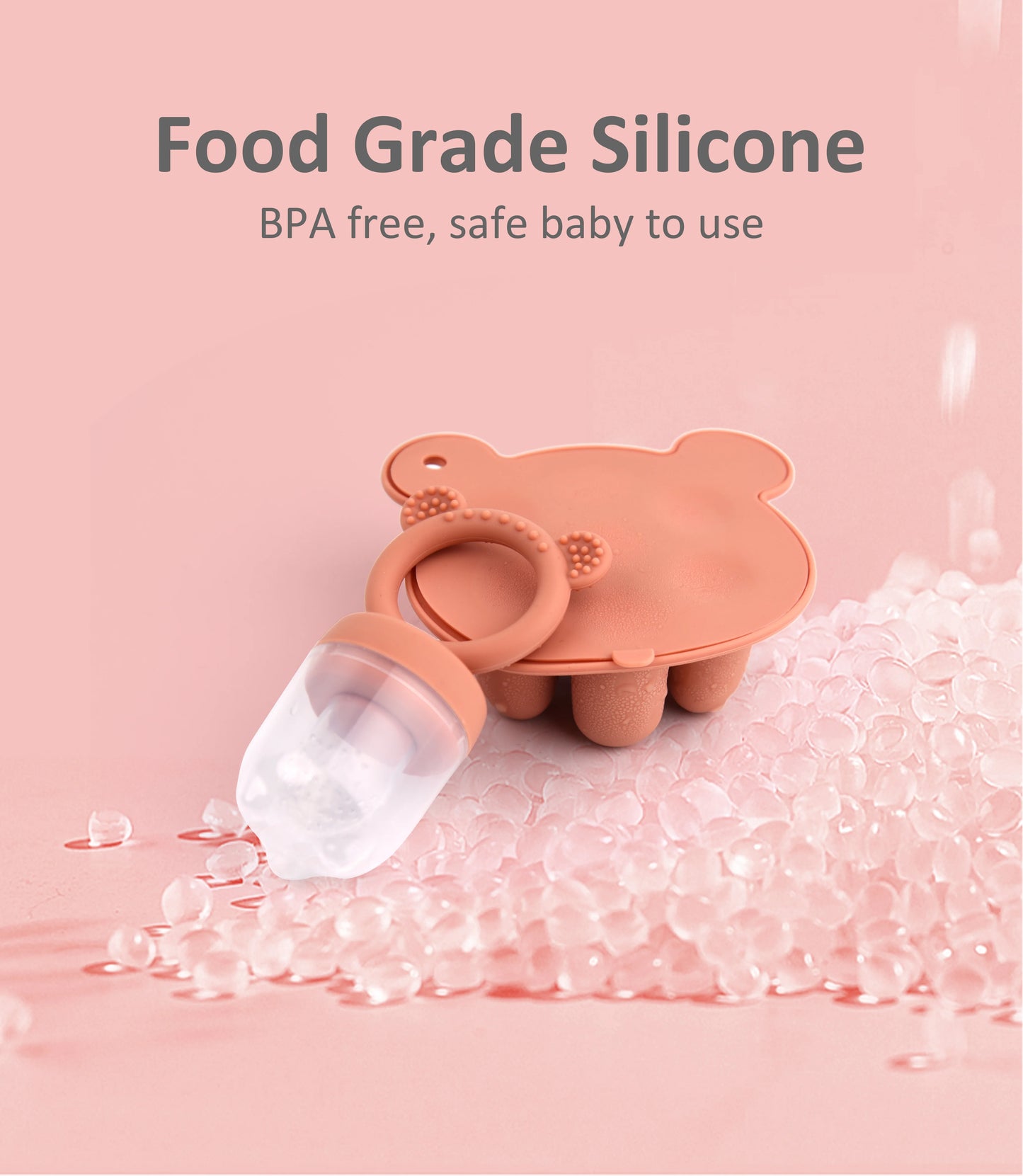 A pink, bear-shaped silicone baby product with a pacifier, on a bed of clear beads, labeled Food Grade Silicone, BPA free, safe baby to use.