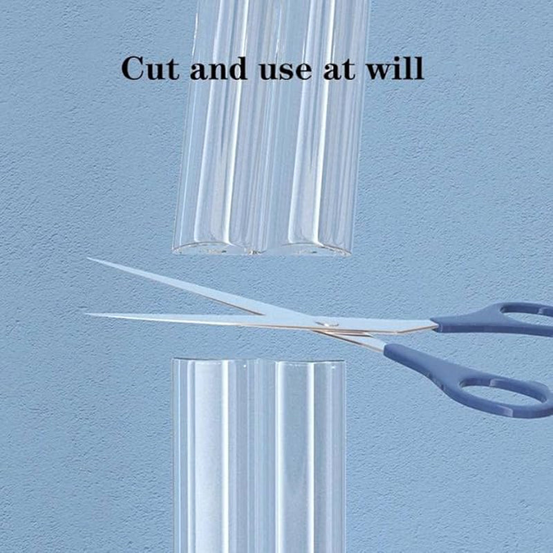 Clear table corner guard strip being cut by scissor