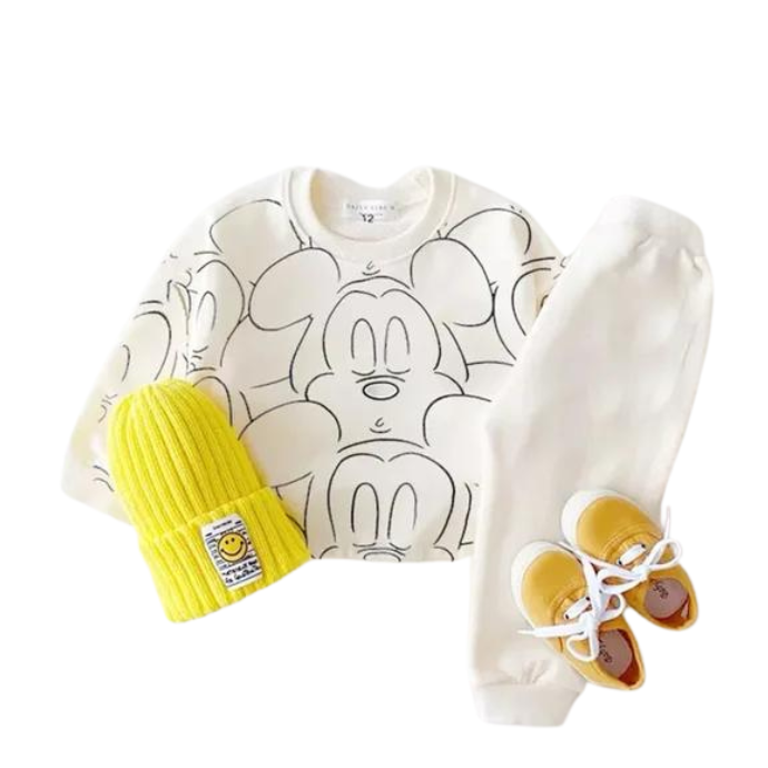White mickey mouse printed tracksuit set with long sleeve pullover shirt, white solid color pants, white beanie with yellow shoes in a white background