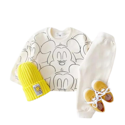 White mickey mouse printed tracksuit set with long sleeve pullover shirt, white solid color pants, white beanie with yellow shoes in a white background