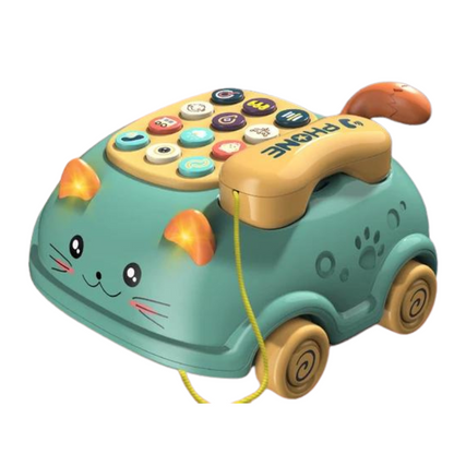 A whimsical teal toy phone with cat features and colorful buttons.