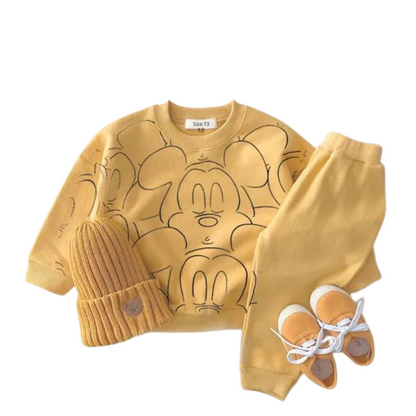Yellow mickey mouse printed tracksuit set with long sleeve pullover shirt, yellow solid color pants, yellow beanie with yellow shoes in a white background