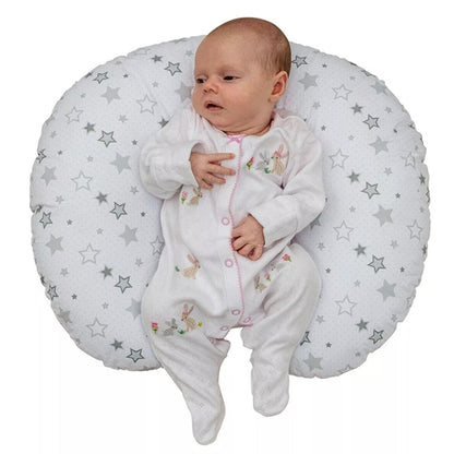 Baby Lying On A Baby Nursing Pillow In A White Background