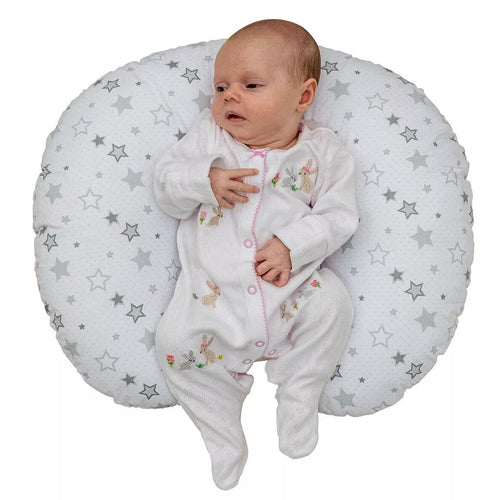 Baby Lying On A Baby Nursing Pillow In A White Background