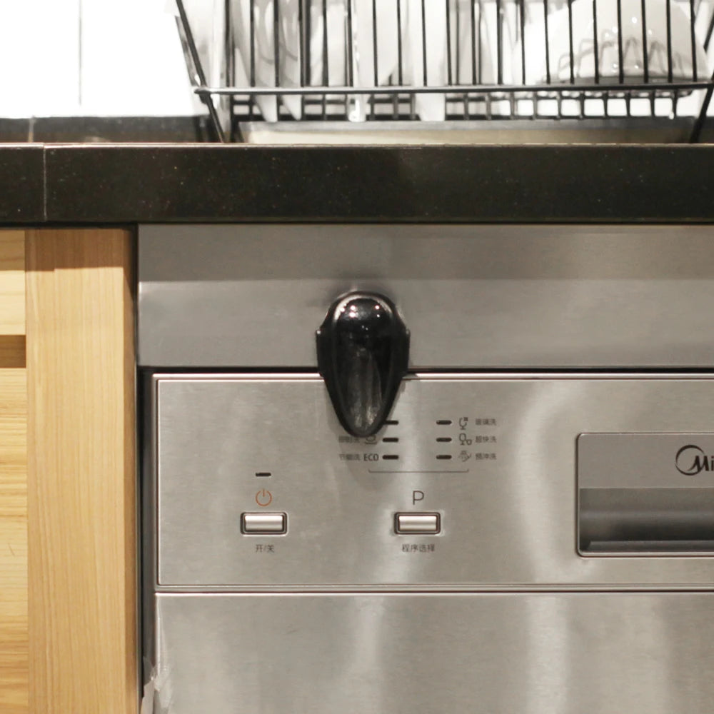  Black Oven & Door Safety Lock affixed to an oven