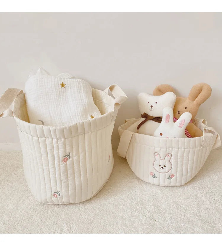 Two Baby Diaper Bag Caddy Organizer With Rabbit  Design In A White Carpet And Background