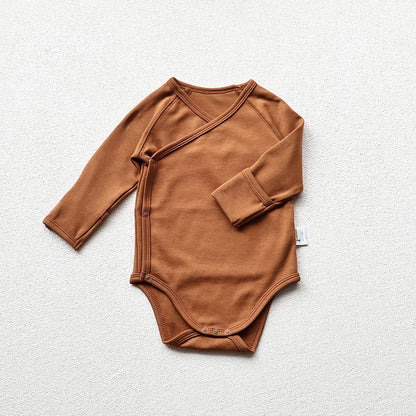 Brown baby long sleeve bodysuit in a light gray background