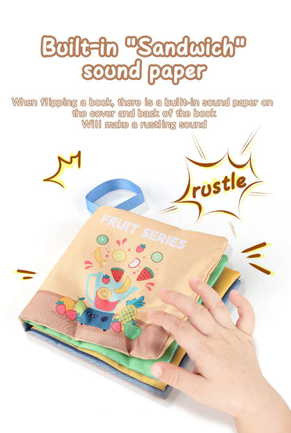 Child's hand flipping a colorful cloth book with fruit illustrations and rustle sound effect graphics.