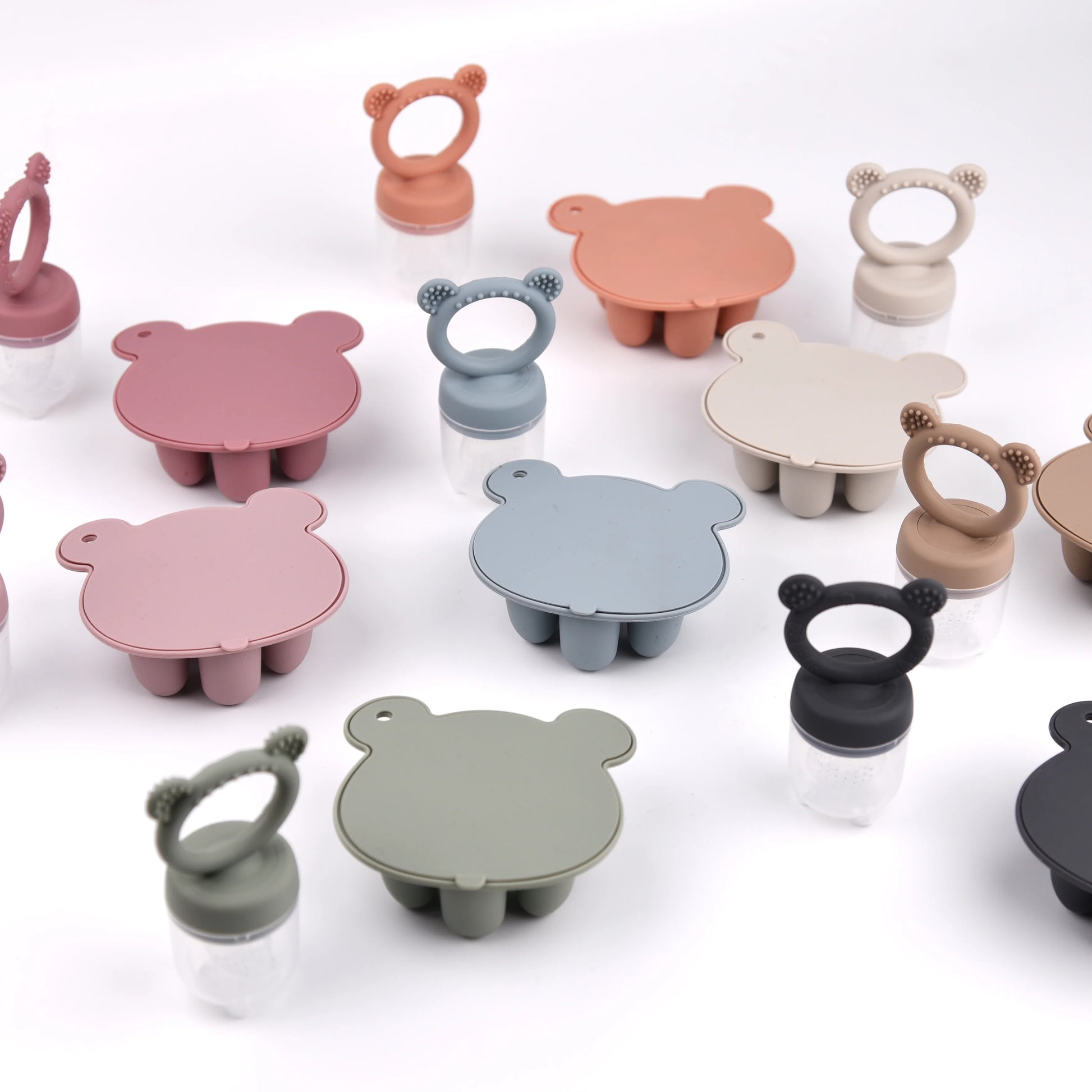 Assorted animal-shaped silicone suction bowls in various colors on a white background.