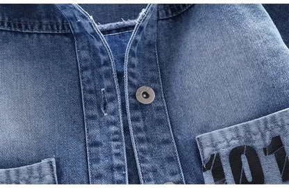A Close Up Picture Of Mickey Mouse Toddler Blue Denim Jacket's Buttons