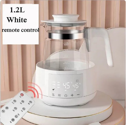 A 1.2L white electric kettle with a digital display and a remote control on a kitchen counter.