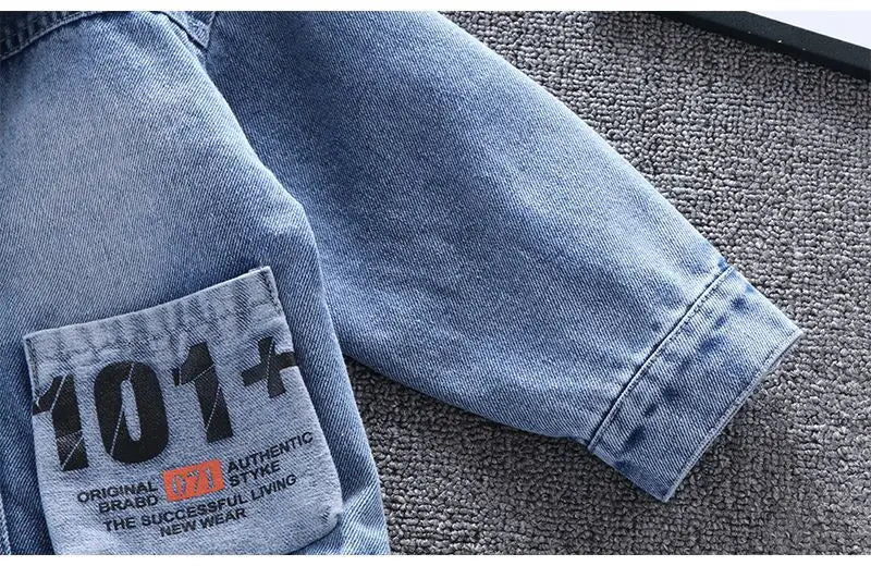 A Close Up Picture Of Mickey Mouse Toddler Blue Denim Jacket's Sleeve