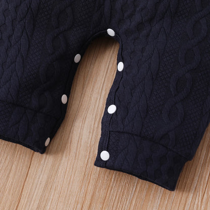 A Close Up Picture Of Red, White, and Navy Blue Colorblock Baby Jumpsuit Romper's Bottom Cuffs and Buttons