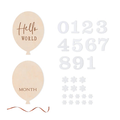 A balloon shaped wooden milestone card set in a white background