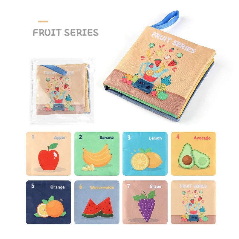 Children's cloth book with fruit-themed educational content, displayed with individual fruit cards.