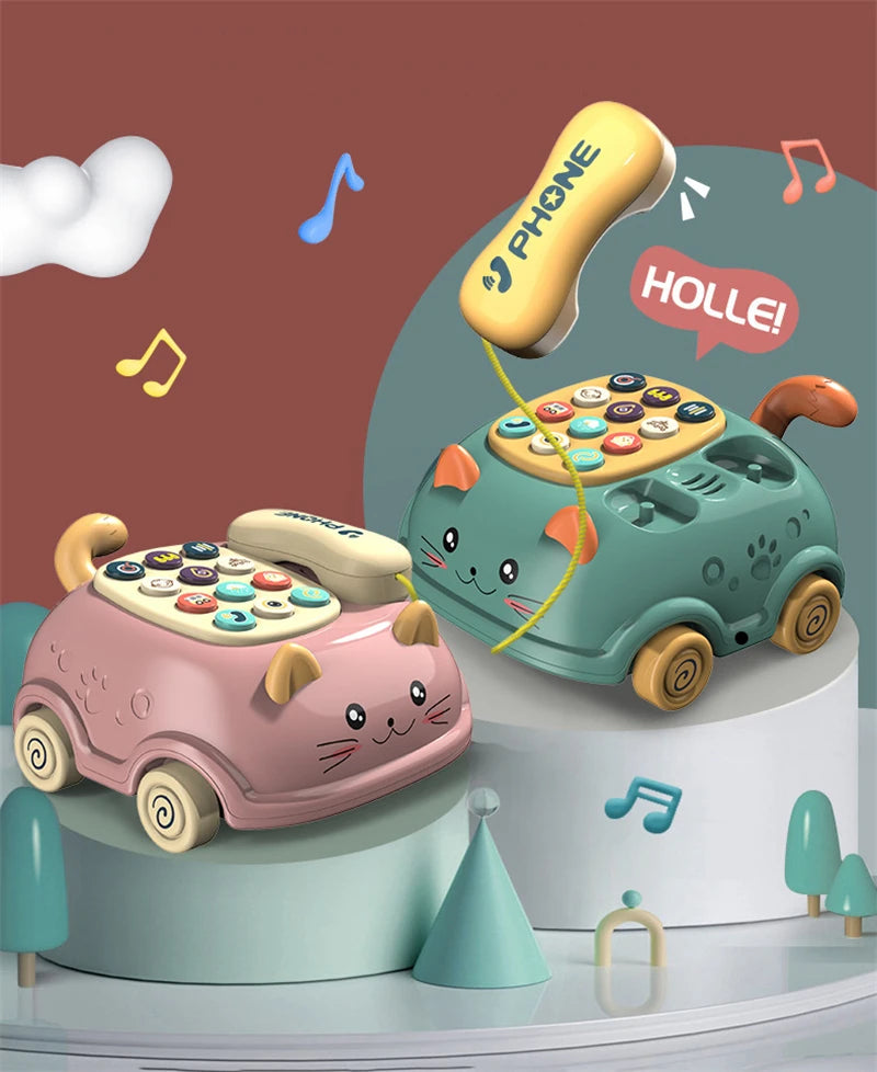 Two whimsical cat-shaped toy telephones in pink and teal, one 'speaking' with text HOLLE!