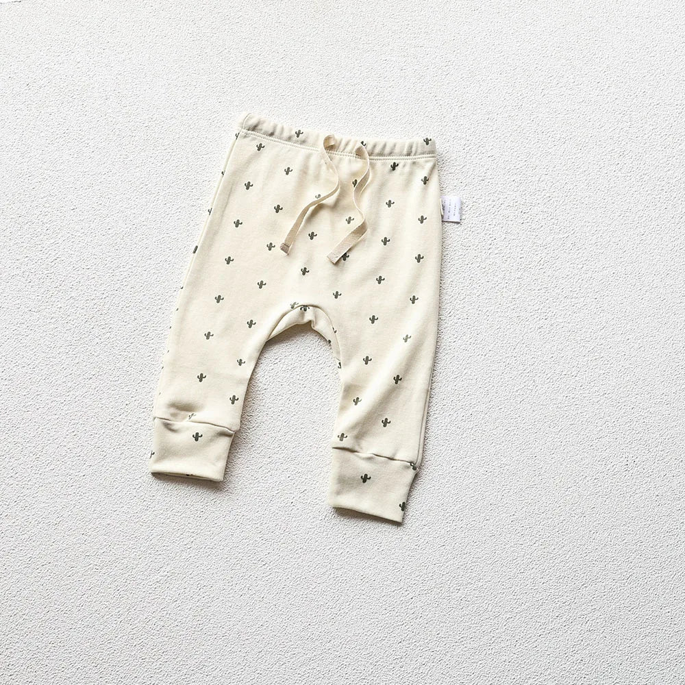 Moon Printed baby pajama pants in a light gray background